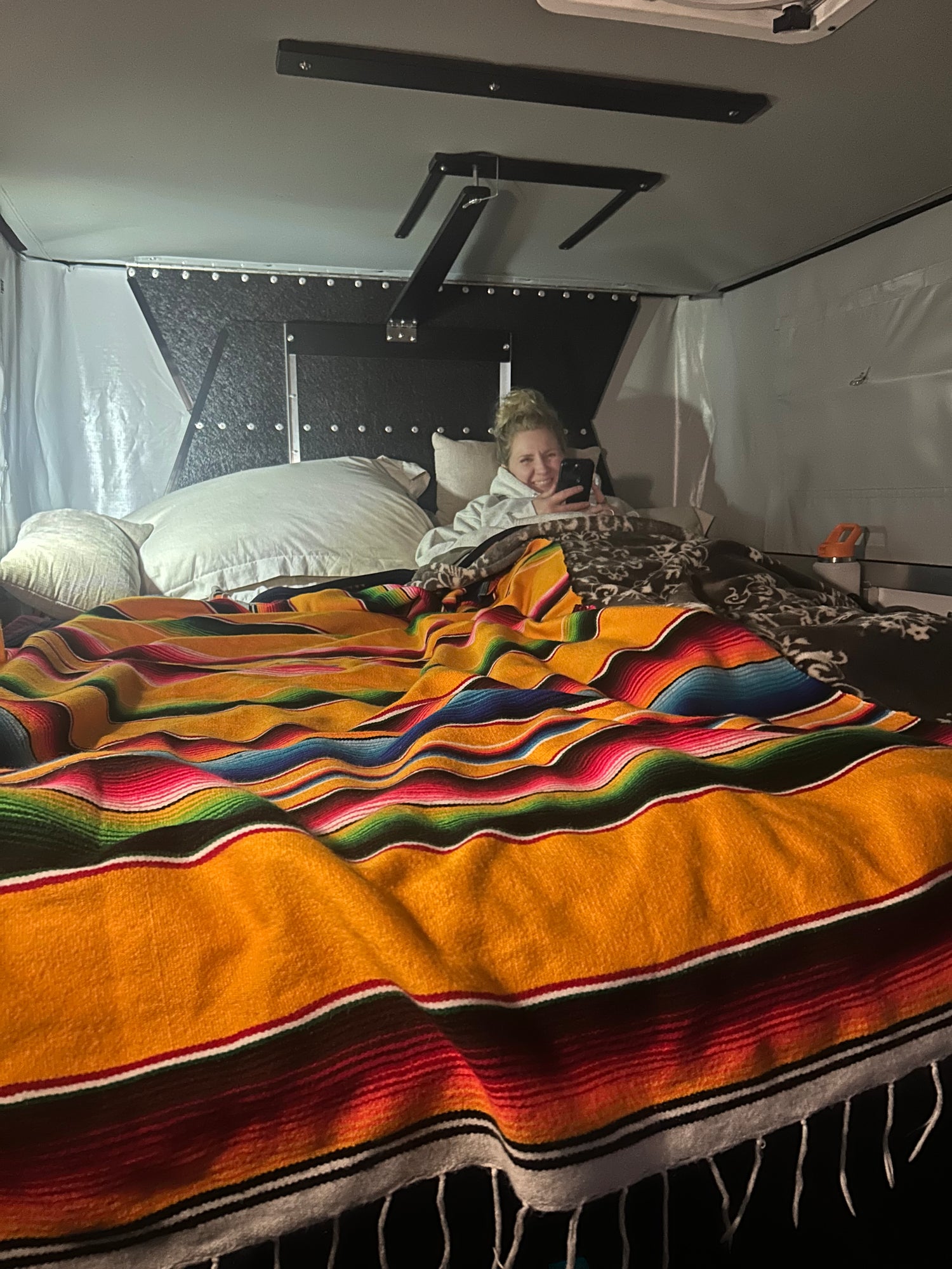 Person in OVRLND Camper Bed